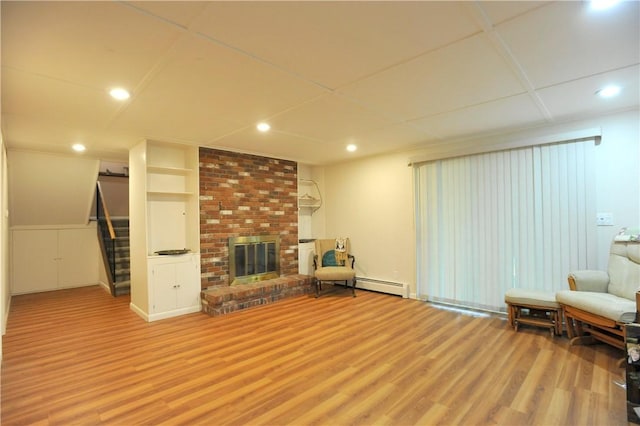 106 Weston Ln, Erwin, NY 14870 - living room featuring wood finished floors, stairs, a baseboard heating unit, a brick fireplace, and recessed lighting