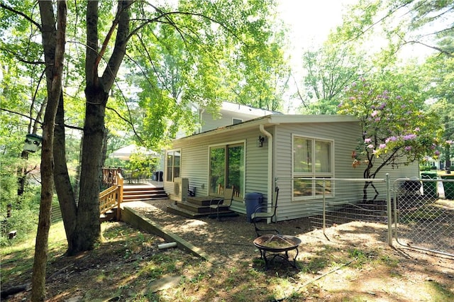 106 Weston Ln, Erwin, NY 14870 - rear view of property with a fire pit and a wooden deck