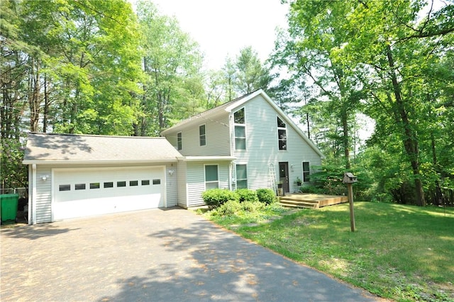 106 Weston Ln, Erwin, NY 14870 - view of front of property with driveway, an attached garage, a front yard, and view of wooded area