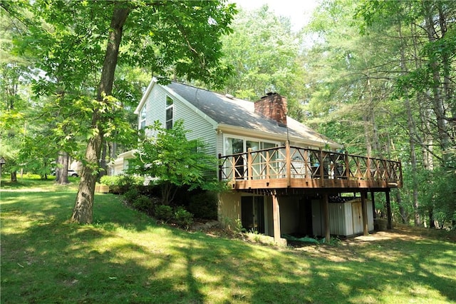 106 Weston Ln, Erwin, NY 14870 - rear view of house featuring a wooden deck, a chimney, a yard, and a view of trees