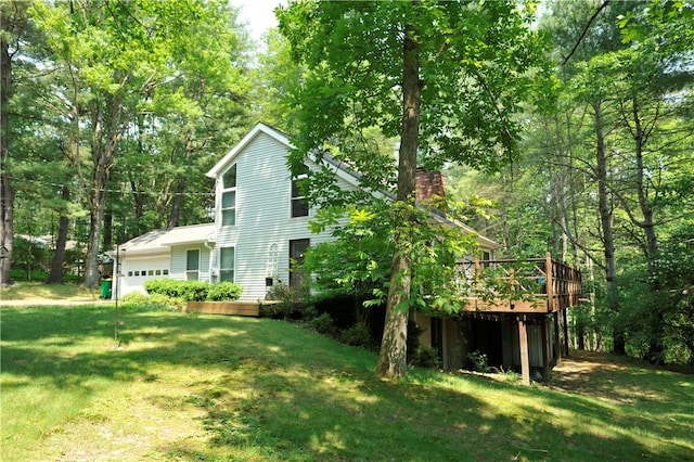 106 Weston Ln, Erwin, NY 14870 - back of property featuring a chimney, a garage, a yard, and a deck