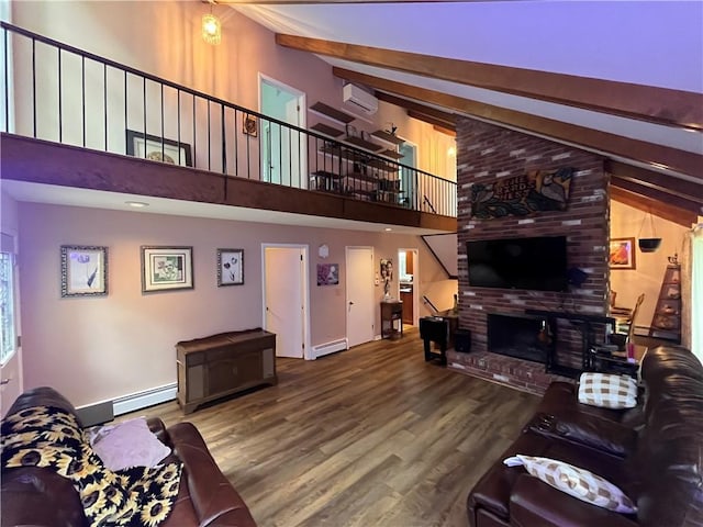 106 Weston Ln, Erwin, NY 14870 - living area featuring beam ceiling, wood finished floors, a wall unit AC, a brick fireplace, and a baseboard heating unit