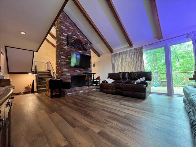 106 Weston Ln, Erwin, NY 14870 - living area with wood finished floors, beamed ceiling, stairs, high vaulted ceiling, and a fireplace