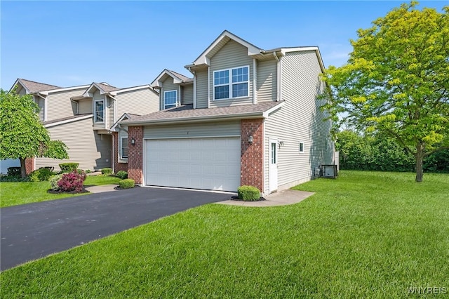 6 Hedge Ln, Lancaster, NY 14086 - view of front of property featuring driveway, brick siding, a front lawn, and an attached garage