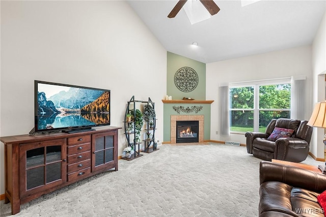6 Hedge Ln, Lancaster, NY 14086 - living area featuring ceiling fan, carpet, a tile fireplace, and high vaulted ceiling