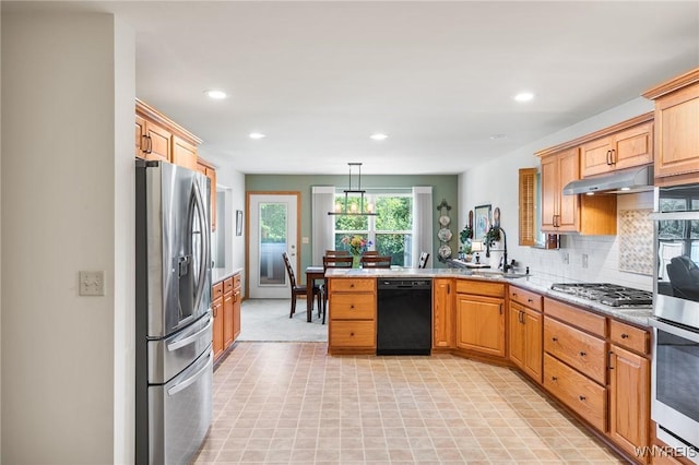 6 Hedge Ln, Lancaster, NY 14086 - kitchen featuring appliances with stainless steel finishes, under cabinet range hood, a peninsula, recessed lighting, and tasteful backsplash