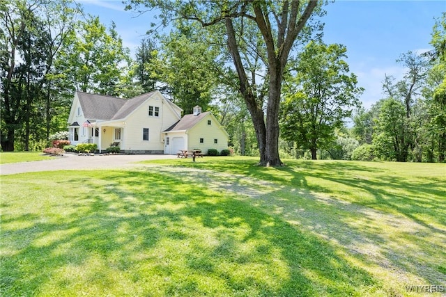 10400 Springville Boston Rd, Concord, NY 14141 - view of grassy yard featuring driveway and an attached garage