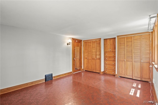 10400 Springville Boston Rd, Concord, NY 14141 - unfurnished bedroom with two closets and tile patterned floors