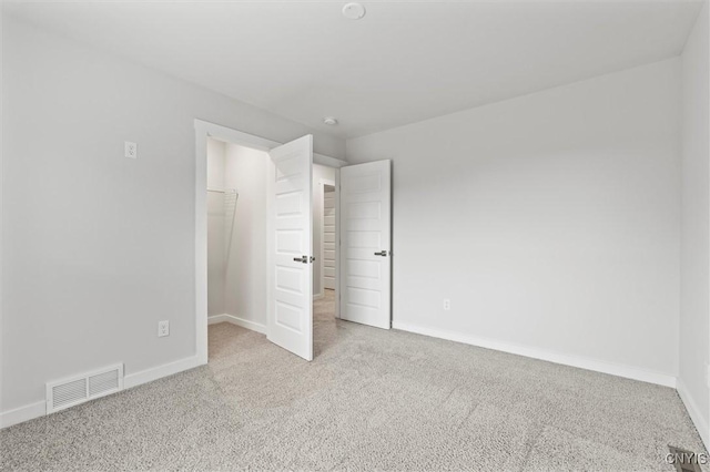 4835 Lepinske Farm Pl, Clay, NY 13041 - unfurnished bedroom with carpet floors, a walk in closet, and a closet