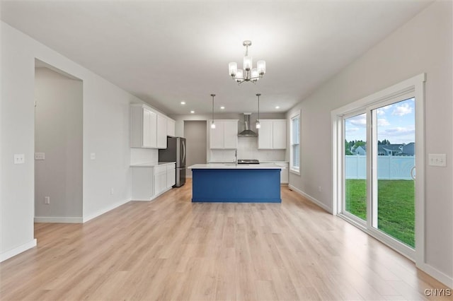 4835 Lepinske Farm Pl, Clay, NY 13041 - kitchen with freestanding refrigerator, wall chimney range hood, a chandelier, light countertops, and recessed lighting