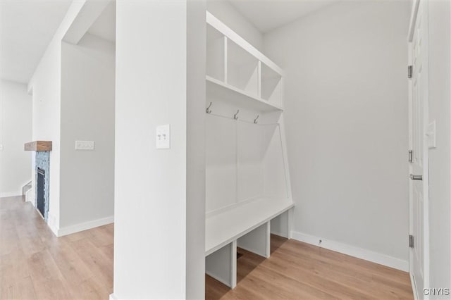 4835 Lepinske Farm Pl, Clay, NY 13041 - mudroom featuring light wood-style flooring and a fireplace