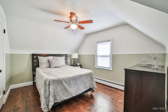 235 Koenig Rd, Tonawanda-Town, NY 14150 - bedroom with a baseboard heating unit, wood finished floors, vaulted ceiling, a wainscoted wall, and ceiling fan