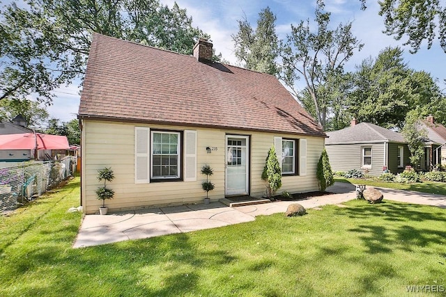 235 Koenig Rd, Tonawanda-Town, NY 14150 - cape cod home featuring a chimney, a shingled roof, and a patio