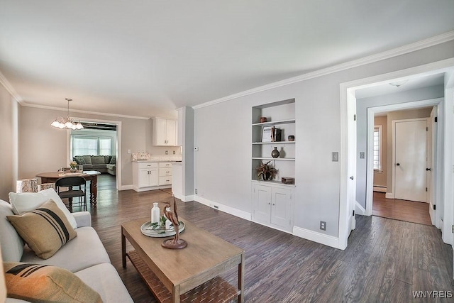 235 Koenig Rd, Tonawanda-Town, NY 14150 - living room with built in shelves, dark wood-style floors, ornamental molding, a chandelier, and a baseboard radiator