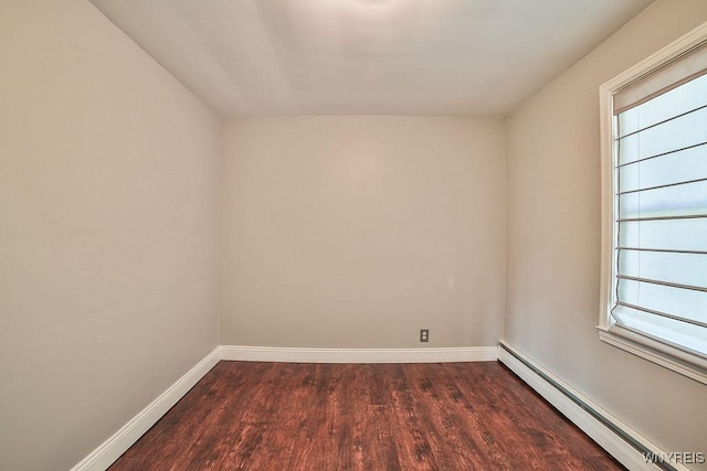 235 Koenig Rd, Tonawanda-Town, NY 14150 - spare room featuring a baseboard heating unit, dark wood-style flooring, and plenty of natural light