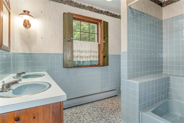 285 Panorama, Penfield, NY 14625 - bathroom featuring a baseboard heating unit, tile walls, double vanity, wainscoting, and shower / bath combination