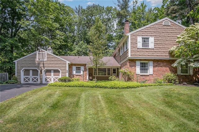 285 Panorama, Penfield, NY 14625 - view of front of property featuring a front yard, a chimney, and brick siding