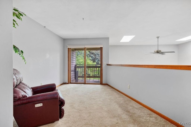 5810 Nobleton Cir, Onondaga, NY 13078 - living area featuring a skylight, carpet flooring, and ceiling fan