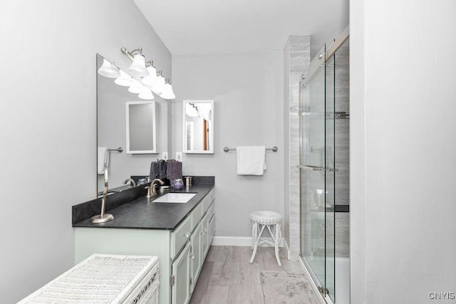 5810 Nobleton Cir, Onondaga, NY 13078 - full bath featuring vanity, a stall shower, and wood finished floors