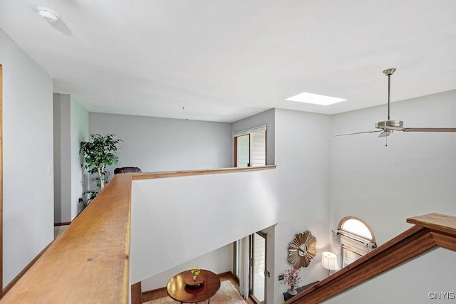 5810 Nobleton Cir, Onondaga, NY 13078 - corridor featuring a skylight and an upstairs landing