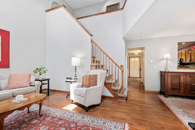 5810 Nobleton Cir, Onondaga, NY 13078 - living area featuring stairs and light wood-style flooring