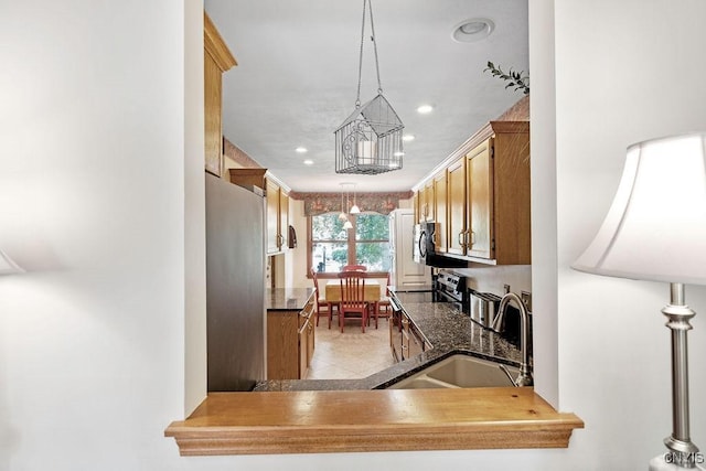 5810 Nobleton Cir, Onondaga, NY 13078 - kitchen with appliances with stainless steel finishes, recessed lighting, light tile patterned floors, and pendant lighting