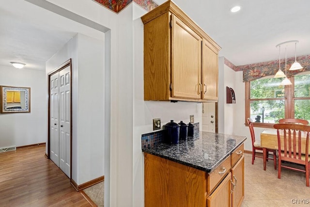 5810 Nobleton Cir, Onondaga, NY 13078 - kitchen with dark stone counters and pendant lighting