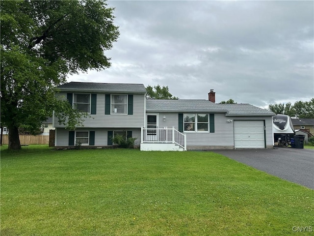 8071 Evesborough Dr, Clay, NY 13041 - split level home featuring a garage, driveway, and a chimney
