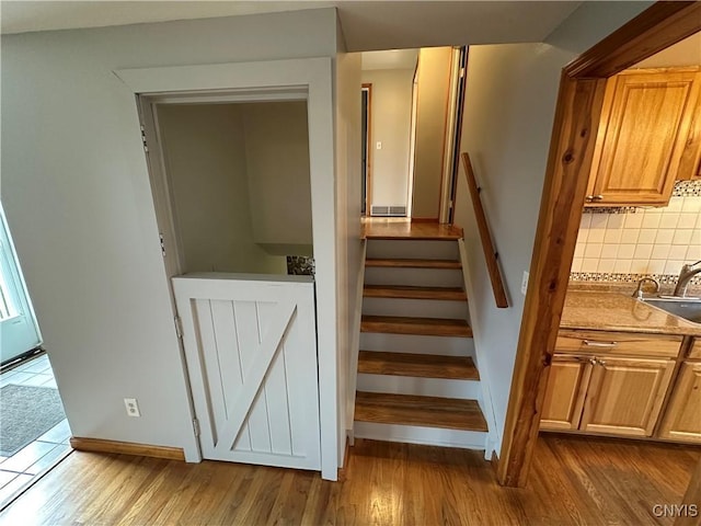 8071 Evesborough Dr, Clay, NY 13041 - stairs featuring wood finished floors and baseboards