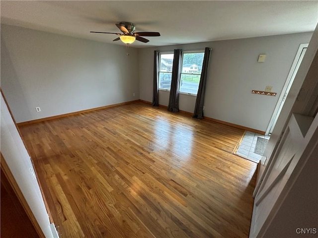 8071 Evesborough Dr, Clay, NY 13041 - unfurnished room featuring light wood finished floors and a ceiling fan