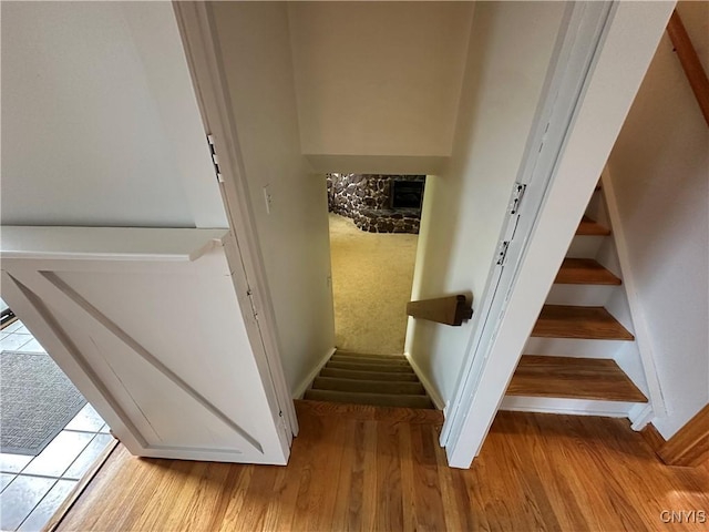 8071 Evesborough Dr, Clay, NY 13041 - staircase with wood finished floors and a fireplace