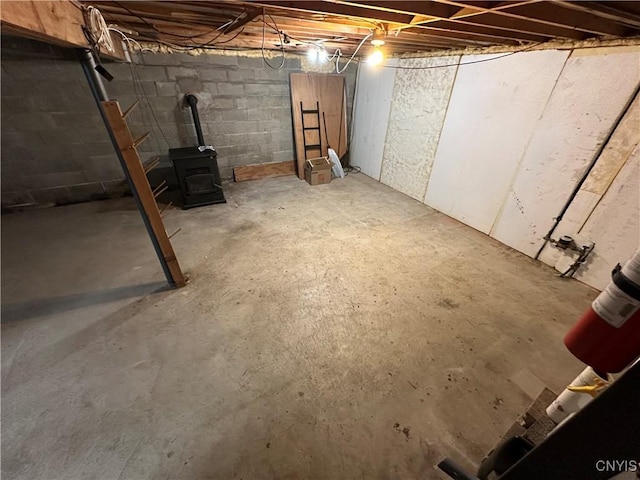 8071 Evesborough Dr, Clay, NY 13041 - unfinished below grade area featuring a wood stove