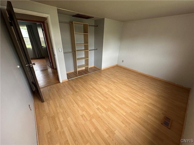 8071 Evesborough Dr, Clay, NY 13041 - unfurnished bedroom with light wood-type flooring and a closet
