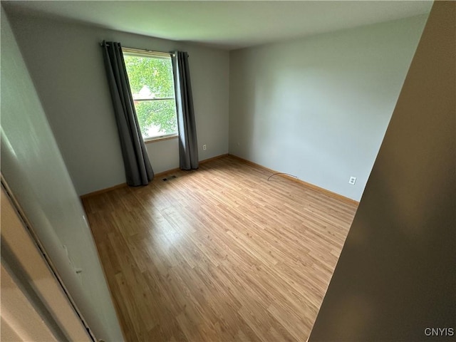 8071 Evesborough Dr, Clay, NY 13041 - unfurnished room with light wood-type flooring and baseboards