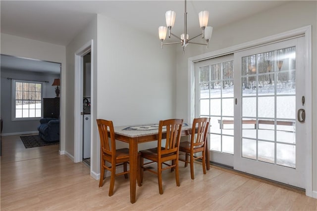 6270 Wolf Run Rd, Campbell, NY 14821 - dining space with light wood finished floors and a chandelier
