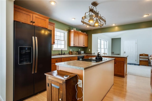 6270 Wolf Run Rd, Campbell, NY 14821 - kitchen with black appliances, a peninsula, a center island, light wood finished floors, and recessed lighting
