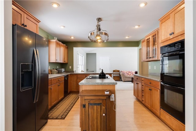 6270 Wolf Run Rd, Campbell, NY 14821 - kitchen featuring black appliances, light wood-type flooring, glass insert cabinets, a peninsula, and a center island