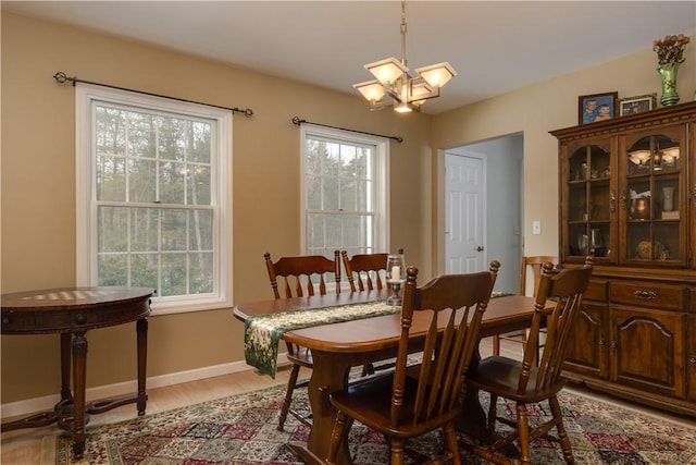 6270 Wolf Run Rd, Campbell, NY 14821 - dining room featuring healthy amount of natural light, a chandelier, and light wood-style floors