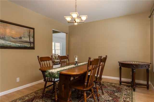 6270 Wolf Run Rd, Campbell, NY 14821 - dining room featuring wood finished floors and a chandelier