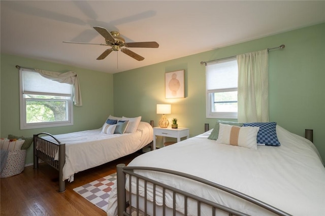 151 Chapel Hill Dr, Irondequoit, NY 14617 - bedroom with multiple windows, wood finished floors, and ceiling fan