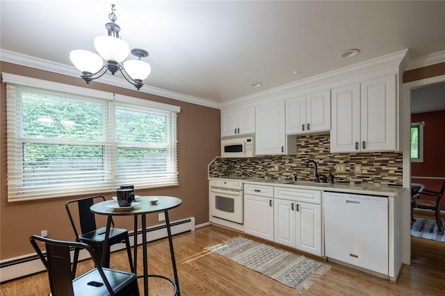 151 Chapel Hill Dr, Irondequoit, NY 14617 - kitchen with white appliances, a chandelier, plenty of natural light, light wood-style flooring, and ornamental molding