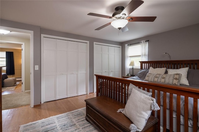 151 Chapel Hill Dr, Irondequoit, NY 14617 - bedroom featuring multiple closets, light wood finished floors, and ceiling fan