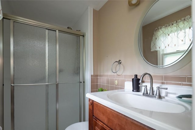 151 Chapel Hill Dr, Irondequoit, NY 14617 - bathroom featuring vanity, a shower stall, and tile walls