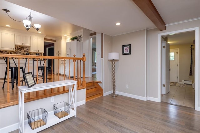 151 Chapel Hill Dr, Irondequoit, NY 14617 - hall with a baseboard radiator, wood finished floors, a chandelier, beamed ceiling, and recessed lighting