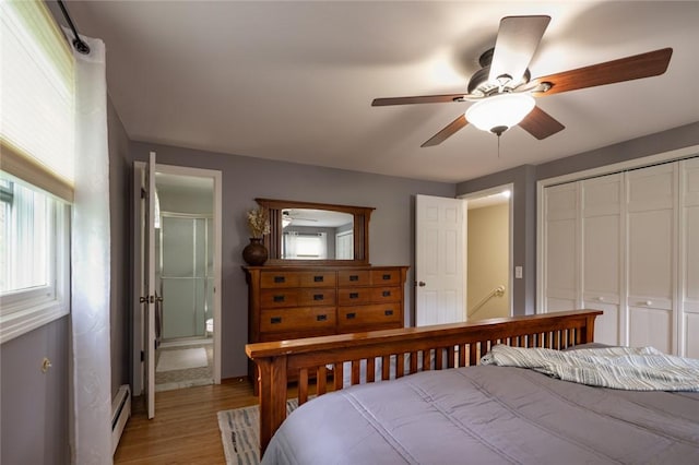 151 Chapel Hill Dr, Irondequoit, NY 14617 - bedroom with a baseboard heating unit, a closet, light wood-style flooring, and a ceiling fan