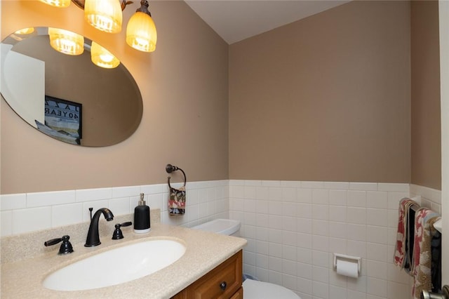 151 Chapel Hill Dr, Irondequoit, NY 14617 - bathroom with vanity, tile walls, a chandelier, and wainscoting