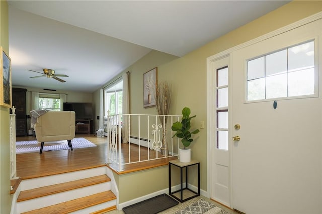 151 Chapel Hill Dr, Irondequoit, NY 14617 - entryway featuring a baseboard radiator, wood finished floors, and a ceiling fan
