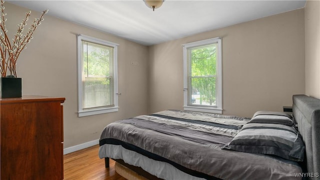 610 Huth Rd, Cheektowaga, NY 14225 - bedroom featuring wood finished floors and baseboards