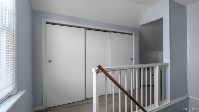 610 Huth Rd, Cheektowaga, NY 14225 - hallway with an upstairs landing, lofted ceiling, and carpet flooring