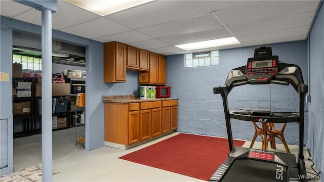 610 Huth Rd, Cheektowaga, NY 14225 - workout area featuring a drop ceiling and concrete block wall